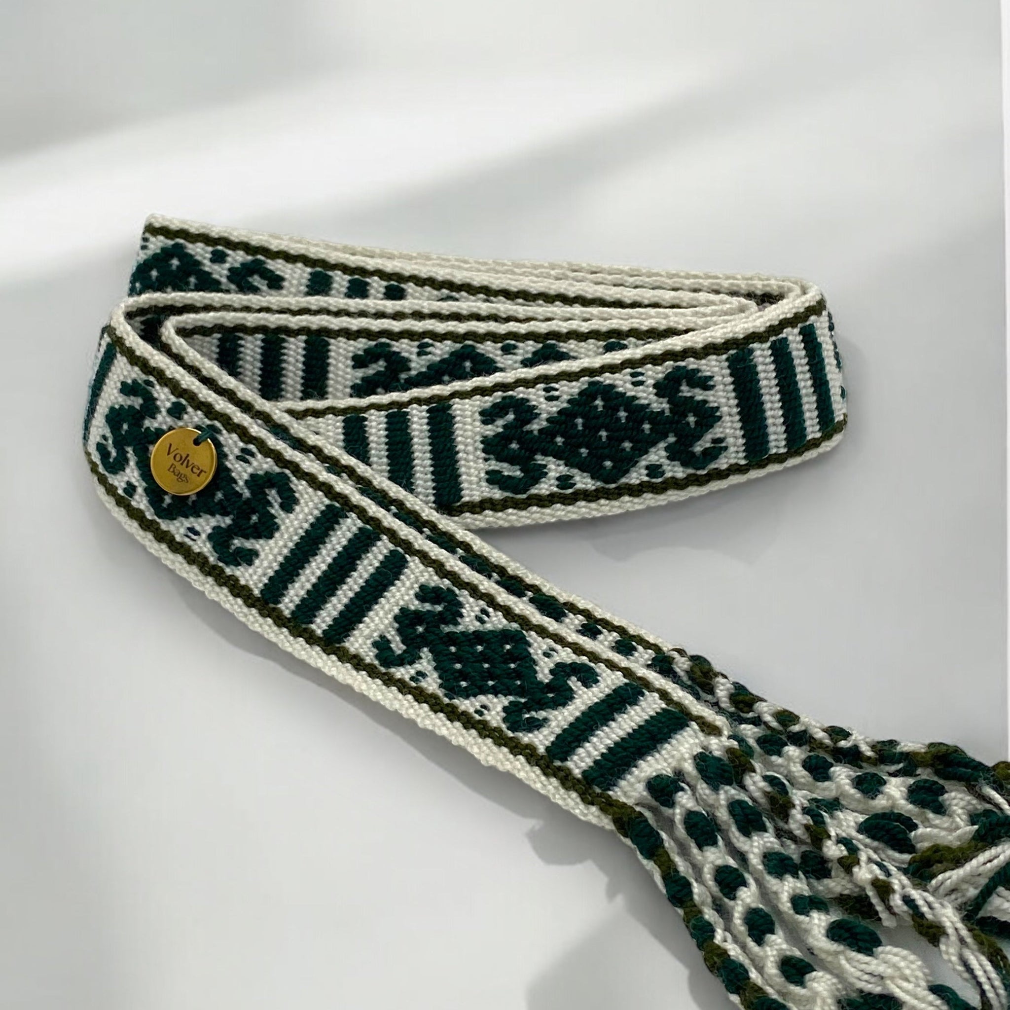 Cintura artigianale tessuta a mano in cotone, colori beige, arancio e nero, realizzata da artigiane colombiane