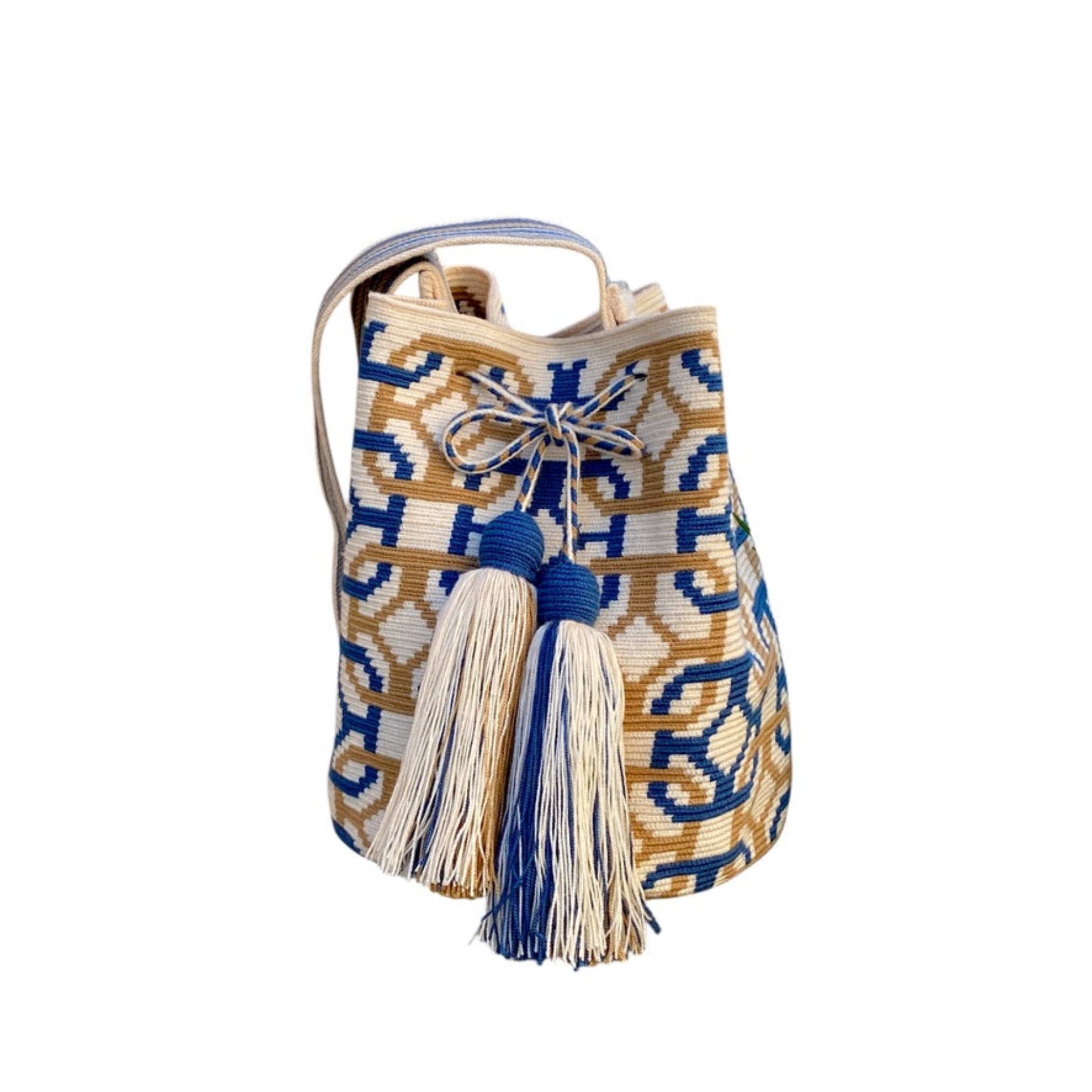 Mochila Wayuu Paraná grande beige e blu con motivi geometrici, tracolla intrecciata e nappine, fatta a mano in Colombia

