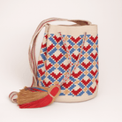 Mochila Piccola Rio - Borsa Wayuu artigianale beige, ocra, rossa e azzurra fatta a mano in Colombia
