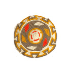 dettaglio della base della borsa con pattern geometrico nei toni caldi dell'ocra ,arancio e tortora