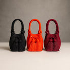 nera arancio e borgogna , tre dei tanti colori disponibili per le mini borse da sera volverina